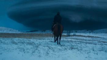 Hazel's Heart movie: Stelio Savante rides a horse towards a black cloud ahead