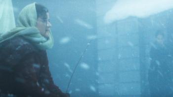 Hazel's Heart movie: Madelyn Dundon sits on top of a sled in a blizzard
