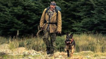 Heart of the Beast movie: James Belmont (Brad Pitt) walks with German Shepherd Odin in a field
