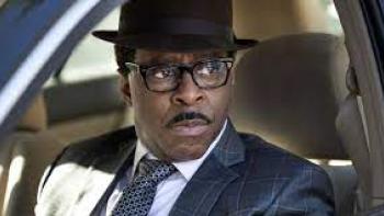 Heist 88: A Black man looks out his car window