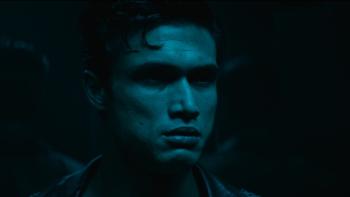 Her Private Hell Movie: Private K, bathed in a blue-green light, looks at something with concern