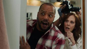 Home Delivery movie: Donald Faison and Lesley Anne Warren peek inside a door with a look of comical shock