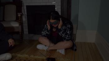 House on Eden Movie: Sitting cross-legged and wearing a mask and earplugs, Celina tries to communicate with spirits