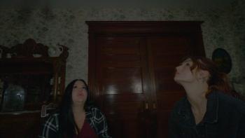 House on Eden Movie: Celina and Kris stare at the ceiling as if they've just heard an alarming sound from above