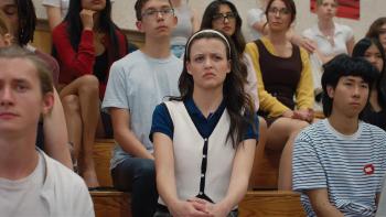 How to Lose a Popularity Contest: Sara Waisglass sits for a school assembly.