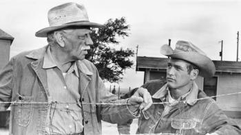 Hud: Melvyn Douglas leans on barbed wire as he talks to Paul Newman on a ranch