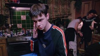 Human Traffic: A young White man experiencing a drugs comedown at a house party with two other party goers behind him