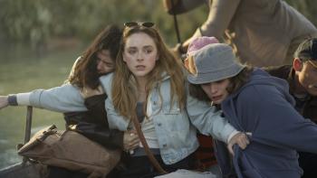 Hungry Movie: Sistine (Madison Davenport) reaches out to protect her fellow passengers as something attacks their boat