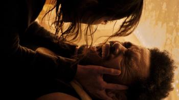 Hurry Up Tomorrow movie: A woman leans over The Weeknd, holding his face as he screams
