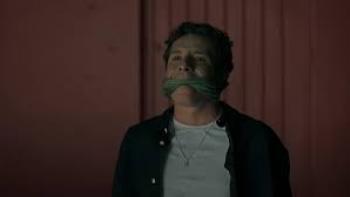 I Don't Expect Anyone to Believe Me scene 3: A man sits with a gag over his mouth