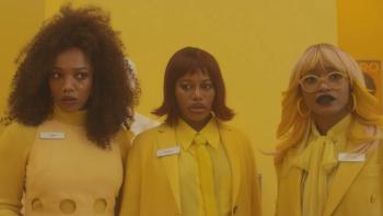 I Love Boosters movie: Three women in monochromatic yellow uniforms look surprised