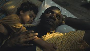 I Was a Stranger movie: Omar Sy lies awake in bed with the young actor playing his son