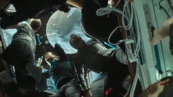 I.S.S. Movie: Astronauts and cosmonauts move through a passageway on the space shuttle