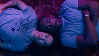 If You Were the Last: Anthony Mackie and Zoe Chao lie on the floor.