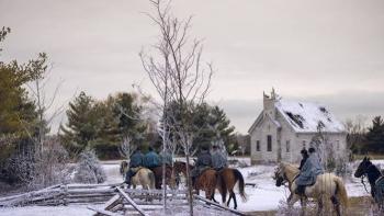 I Heard the Bells movie: Riders on horseback in snowy countryside near a small house.