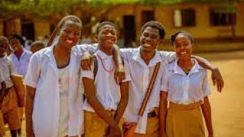 Ijogbon scene 2: Smiling group of Black young people outside