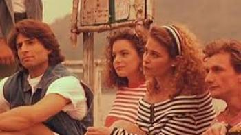 Indian Summer: Characters sit on a dock closeup