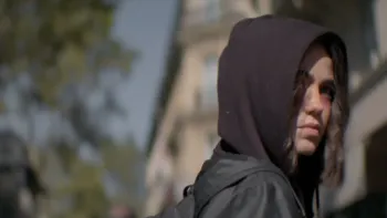 Influencers movie: Cassandra Naud in a hoodie covers most of her face, right, while standing outside