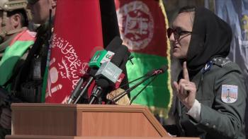 Zarifa Ghafari addresses the public at a podium.