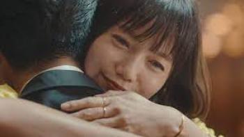 In Love and Deep Water: Asian woman happily embraces a man