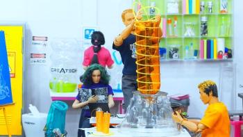 Inventors: A group of dolls work on a colorful science project