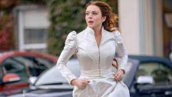 Irish Wish: Lindsay Lohan runs in a wedding dress.