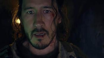 Iron Lung Movie: Simon (Mark Fischbach), a cut on his lower lip, has a frightened expression on his face