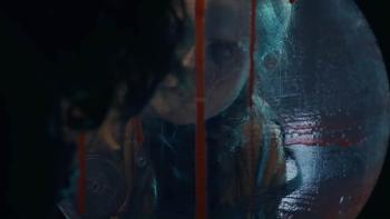 Iron Lung Movie: Through the window of the Iron Lung, dripping with blood, a woman's face is visible