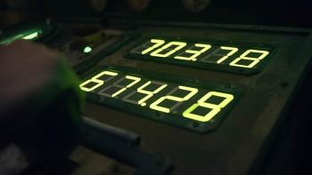 Iron Lung Movie: A hand adjusts a control next to a panel of five-digit digital numbers