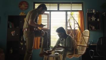 Jailer: A character polishes the shoes of his son who is a police officer