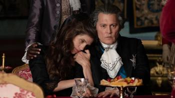 Jeanne du Barry movie: Wearing clothes of French aristocracy, Jeanne (Maiwenn) snuggles with King Louis XV (Johnny Depp)