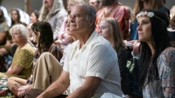 Jesus Revolution Movie: Kelsey Grammer sits on the floor alongside Flower Children of the late 1960s
