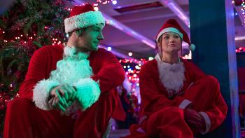 Jingle Bell Heist: Connor Swindells and Olivia Holt dressed as Santas.