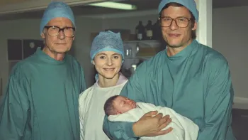 Joy: Bill Nighy, Thomasin McKenzie, and James Norton holding a baby