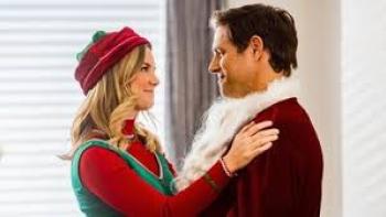 Joy for Christmas: Cindy Busby and Sam Page embrace