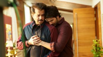 Jug Jugg Jeeyo: A young Indian man hugs an older man from behind