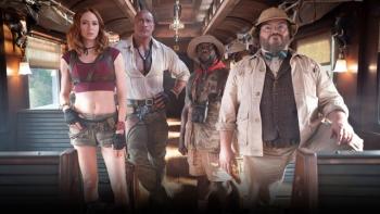 Jumanji: Open World Movie: Characters stand confidently inside a vintage train car