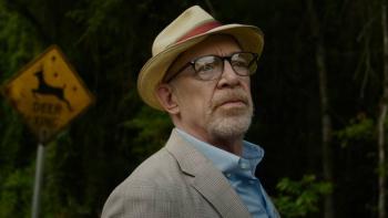 Juror #2 Movie: Juror Harold (J.K. Simmons) stands in front of a "Deer Xing" sign