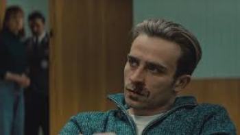 Justice: White man sits with people in doorway