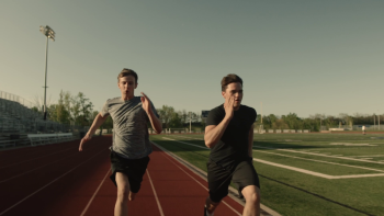 Student athletes Mack Norman (left) and friend Dylan Scheidt on running track