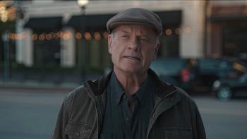 Karen Kingsbury's The Christmas Ring movie: Kelsey Grammer stands in the street looking up at his shop, off camera