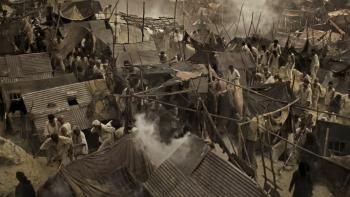 K.G.F -- Chapter 1: An aerial shot of a camp of enslaved workers