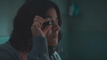 Khufiya: An Indian woman inspects a hidden camera lens.