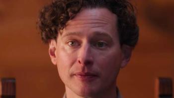 Kill. Bury. Print. movie: Curly-haired person with a neutral expression and blurred brown background.