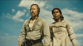 Killing Faith Movie: Against a partly cloudy sky, Bender and Sarah react to something shocking or upsetting