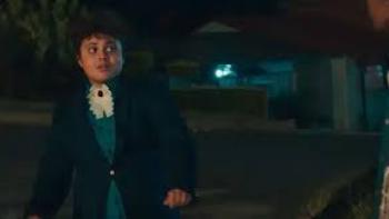 Kings of Mulberry Street: Let Love Reign: An Indian South African boy in dark suit, blue shirt, and white lapel left dances