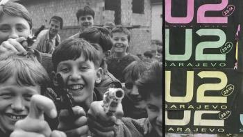 Kiss the Future Movie: Image of Bosnian children smiling while holding firearms with U2 Sarajevo concert posters