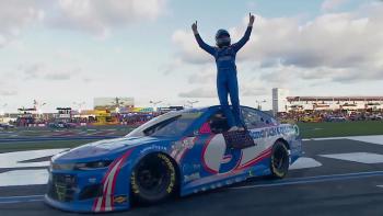 Kyle Larson vs. The Double movie: Kyle Larson in full NASCAR uniform stands on top of his stock car after a win