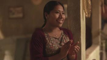 The Great Seduction: Ana (Yalitza Aparicio) is clapping and smiling