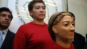 The Lady of Silence: Woman stands behind figure of her likeness